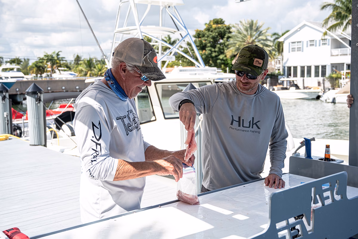 Fishermen using The Edge Fish Cleaning Station