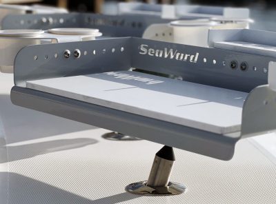 Gray and white Boat Bait Station in the fishing rod holder of a boat.